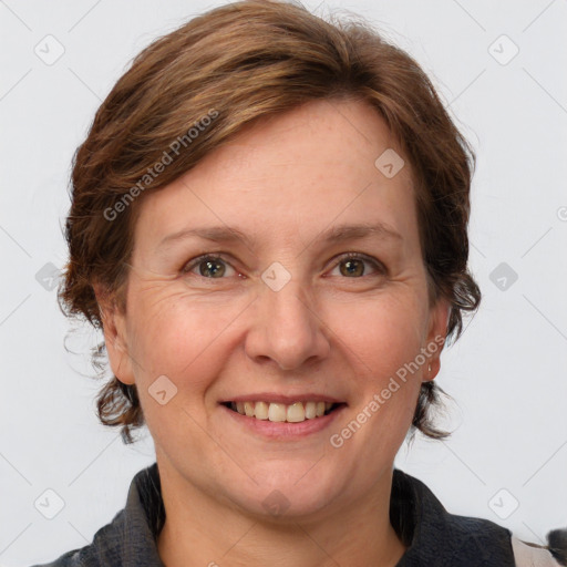 Joyful white adult female with medium  brown hair and grey eyes