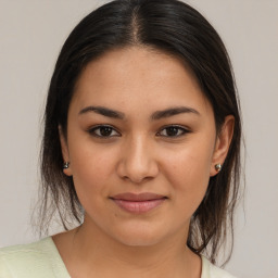 Joyful white young-adult female with medium  brown hair and brown eyes