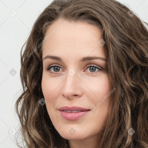 Joyful white young-adult female with long  brown hair and green eyes