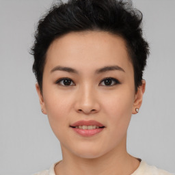 Joyful asian young-adult female with short  black hair and brown eyes