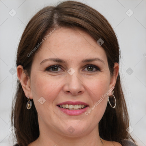 Joyful white adult female with medium  brown hair and grey eyes