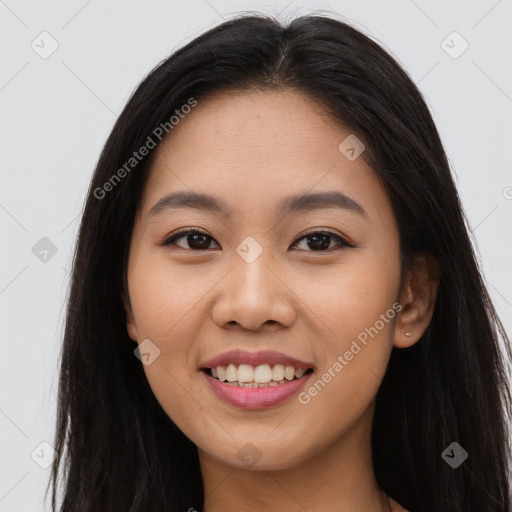 Joyful asian young-adult female with long  brown hair and brown eyes