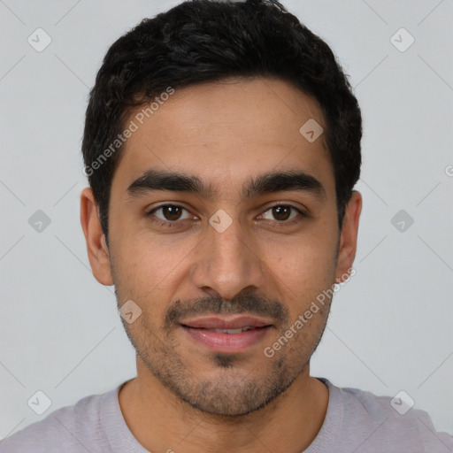 Joyful latino young-adult male with short  black hair and brown eyes