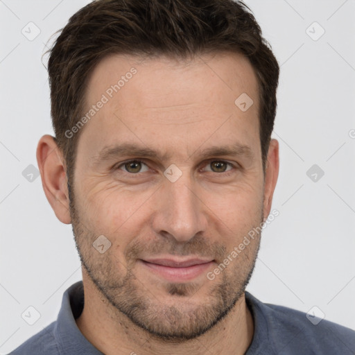 Joyful white adult male with short  brown hair and grey eyes