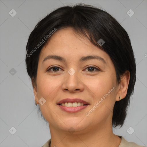 Joyful asian adult female with medium  brown hair and brown eyes