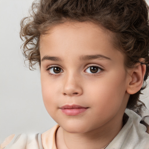 Joyful white child female with medium  brown hair and brown eyes