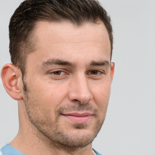 Joyful white adult male with short  brown hair and brown eyes