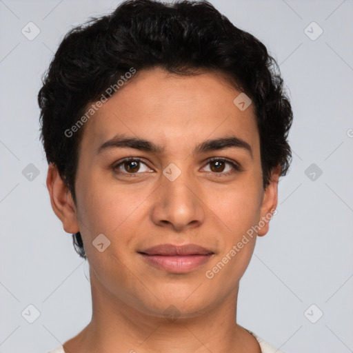 Joyful latino young-adult male with short  brown hair and brown eyes