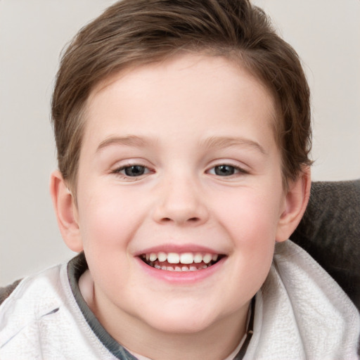 Joyful white child female with short  brown hair and grey eyes