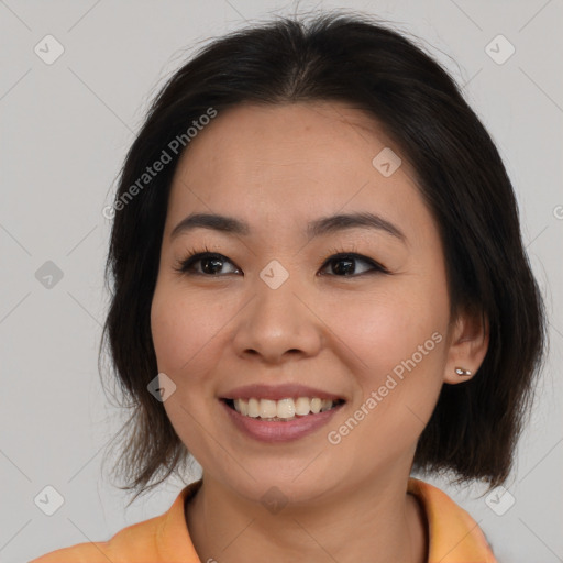 Joyful asian young-adult female with medium  brown hair and brown eyes