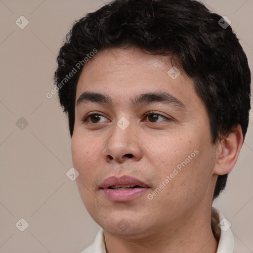 Joyful white adult male with short  black hair and brown eyes