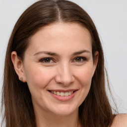 Joyful white young-adult female with long  brown hair and grey eyes