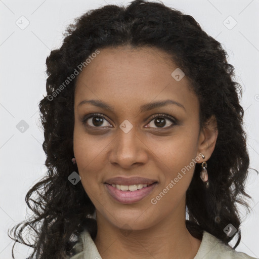 Joyful black young-adult female with long  brown hair and brown eyes