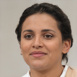 Joyful latino young-adult female with short  brown hair and brown eyes