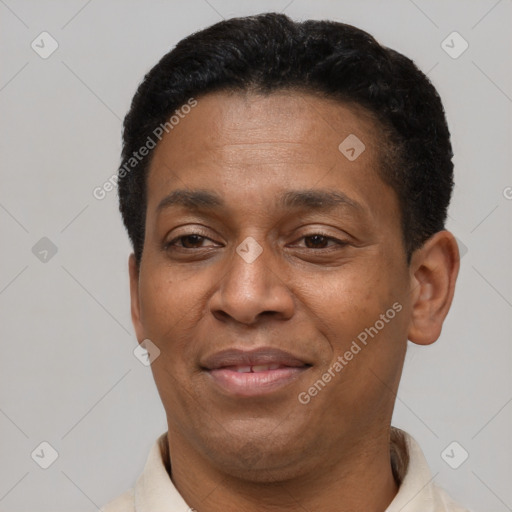 Joyful latino young-adult male with short  brown hair and brown eyes