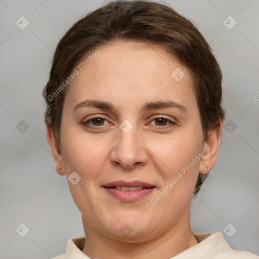 Joyful white adult female with short  brown hair and brown eyes