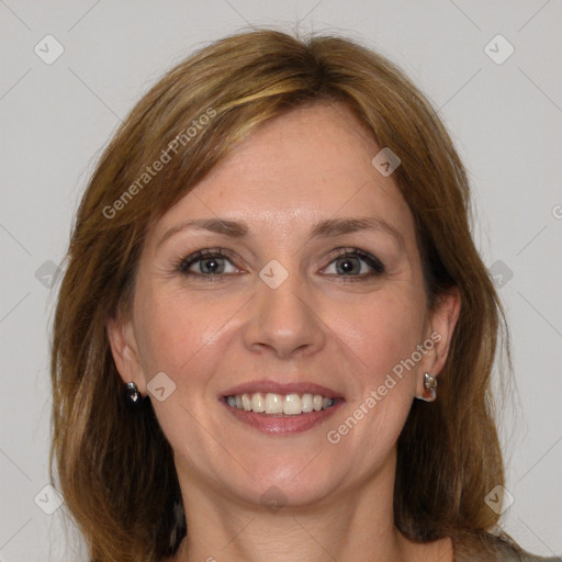 Joyful white adult female with medium  brown hair and grey eyes