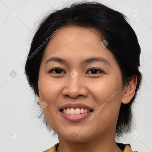 Joyful asian young-adult female with medium  brown hair and brown eyes