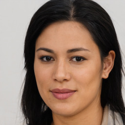 Joyful asian young-adult female with long  brown hair and brown eyes