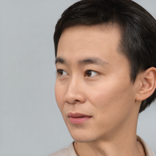 Neutral asian young-adult male with short  black hair and brown eyes