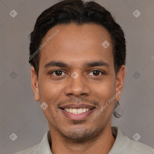 Joyful white young-adult male with short  black hair and brown eyes