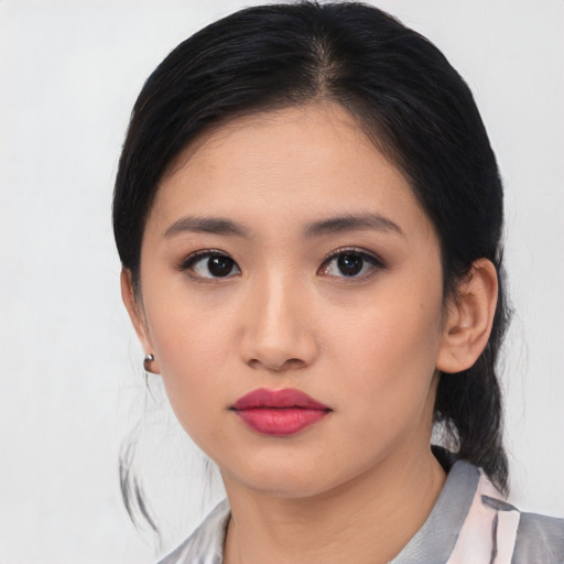 Neutral asian young-adult female with medium  black hair and brown eyes