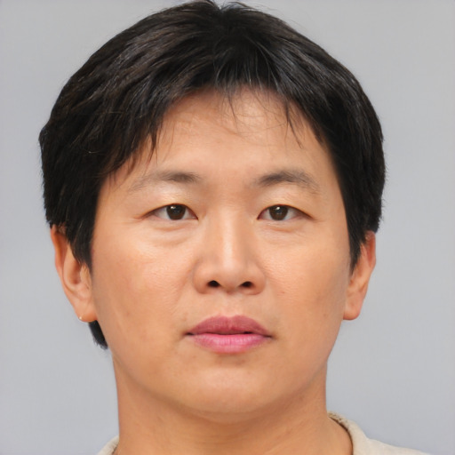 Neutral asian adult male with short  brown hair and brown eyes