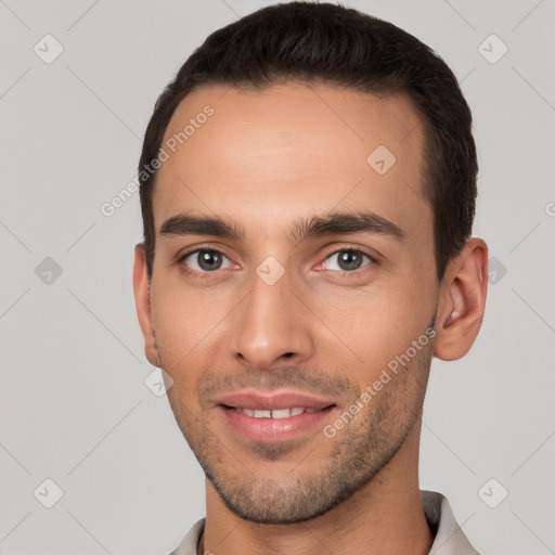 Joyful white young-adult male with short  brown hair and brown eyes