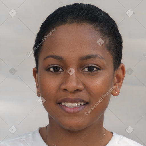 Joyful black young-adult female with short  brown hair and brown eyes