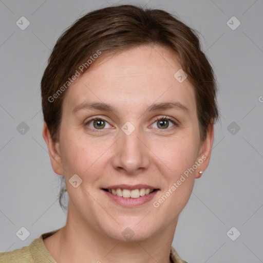 Joyful white young-adult female with short  brown hair and grey eyes