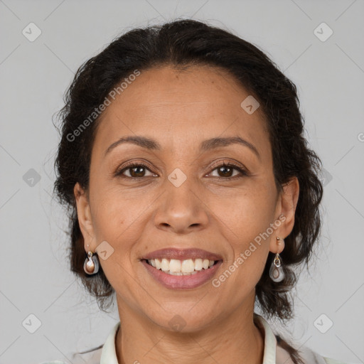 Joyful latino adult female with medium  brown hair and brown eyes