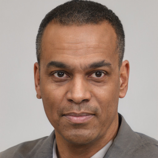 Neutral latino adult male with short  black hair and brown eyes