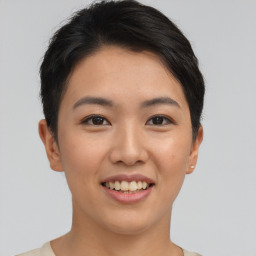 Joyful asian young-adult female with short  black hair and brown eyes