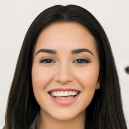 Joyful latino young-adult female with long  black hair and brown eyes