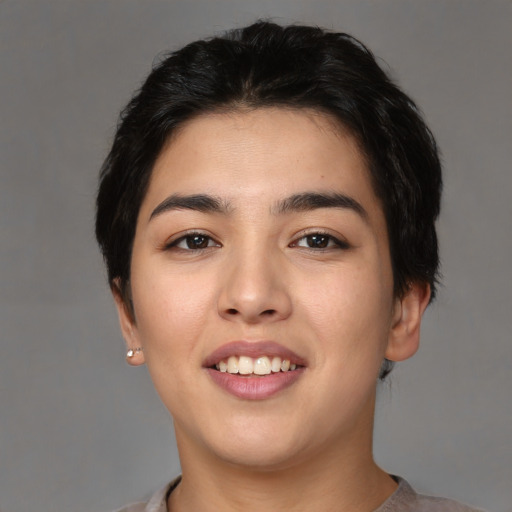 Joyful white young-adult female with short  black hair and brown eyes