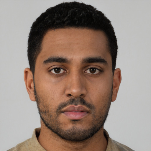 Neutral latino young-adult male with short  black hair and brown eyes