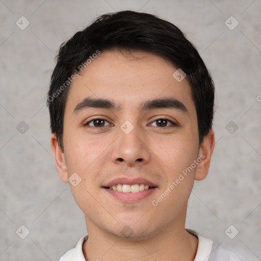 Joyful white young-adult male with short  black hair and brown eyes