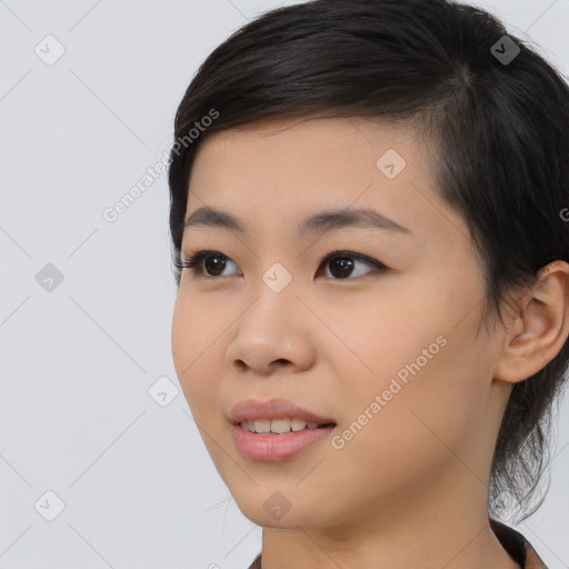 Joyful asian young-adult female with medium  black hair and brown eyes