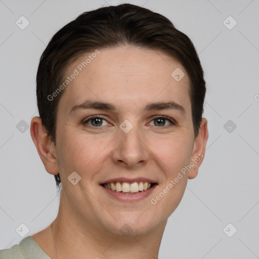 Joyful white young-adult female with short  brown hair and grey eyes