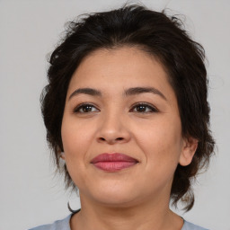 Joyful asian young-adult female with medium  brown hair and brown eyes