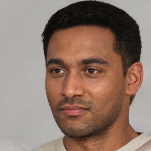 Neutral black young-adult male with short  black hair and brown eyes