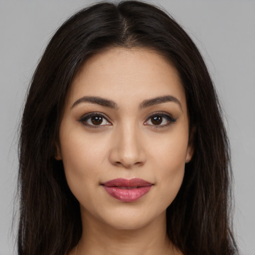 Joyful white young-adult female with long  brown hair and brown eyes