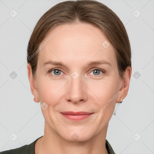 Joyful white adult female with short  brown hair and grey eyes