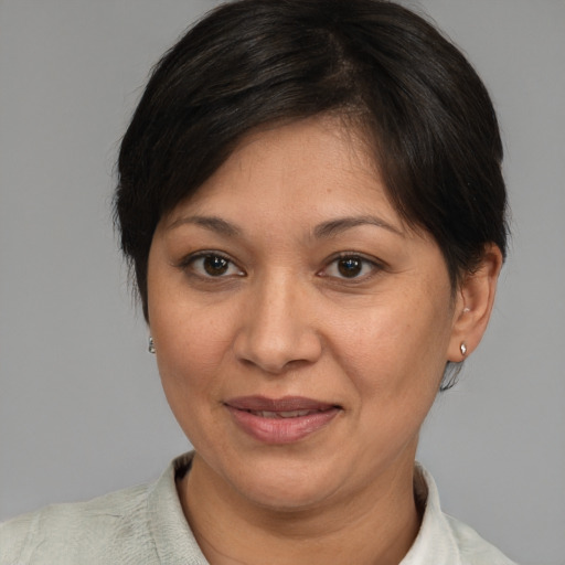 Joyful white adult female with medium  brown hair and brown eyes