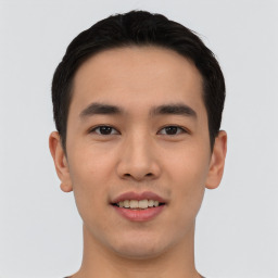 Joyful asian young-adult male with short  black hair and brown eyes