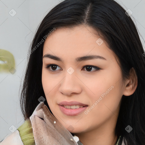 Joyful asian young-adult female with long  brown hair and brown eyes