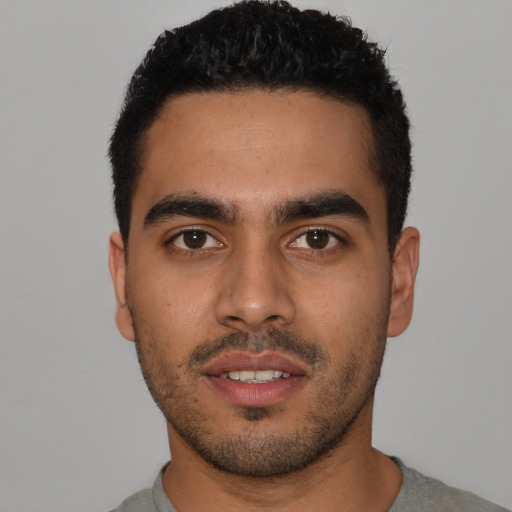 Neutral latino young-adult male with short  black hair and brown eyes