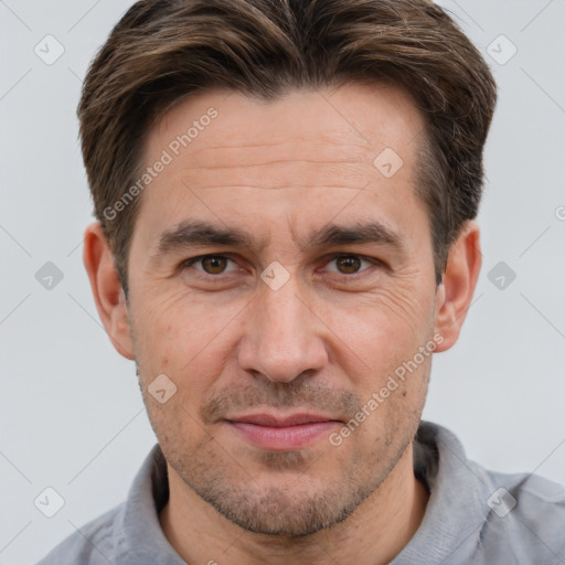 Joyful white adult male with short  brown hair and brown eyes