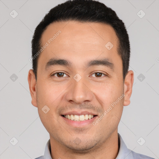 Joyful white young-adult male with short  black hair and brown eyes