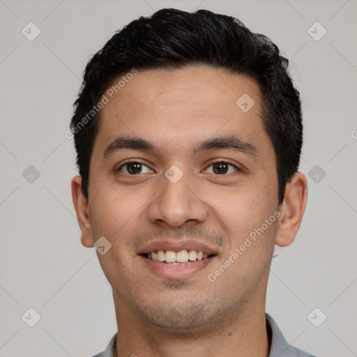 Joyful white young-adult male with short  black hair and brown eyes